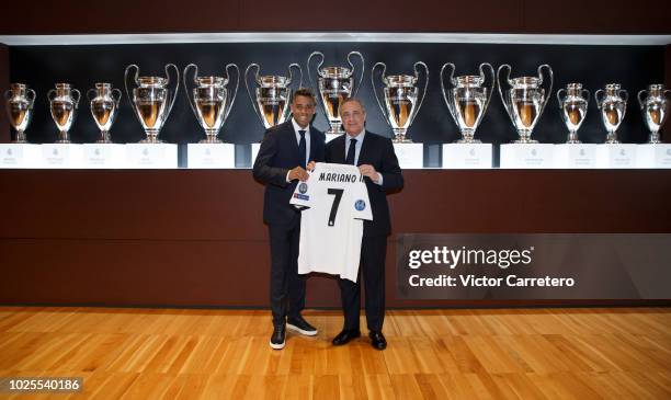 Mariano Diaz of Real Madrid poses with President Florentino Perez during his official presentation at Santiago Bernabeu stadium on August 31, 2018 in...