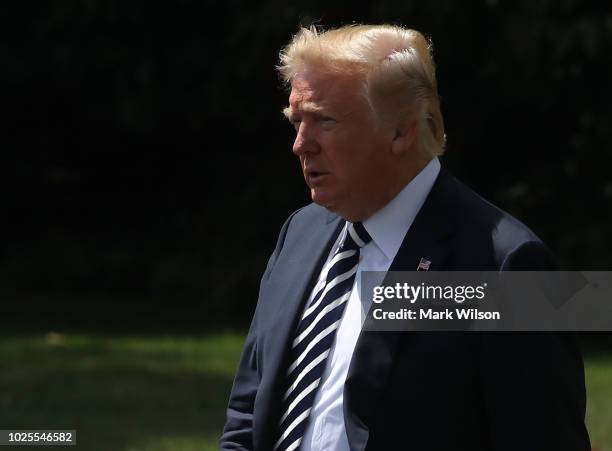 President Donald Trump walks toward Marine One while departing from the White House on August 31, 2018 in Washington, DC. President Trump is...