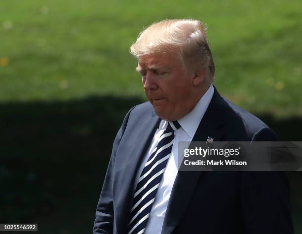 President Donald Trump walks toward Marine One while departing from the White House on August 31, 2018 in Washington, DC. President Trump is...