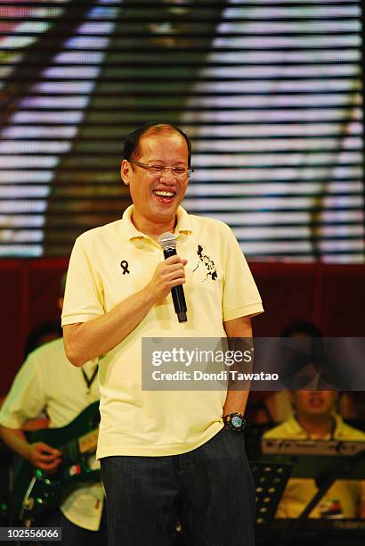 Incoming President-elect Benigno 'Noynoy' Aquino sings during the inauguration street party of Aquino as the fifteenth President of the Philippines...