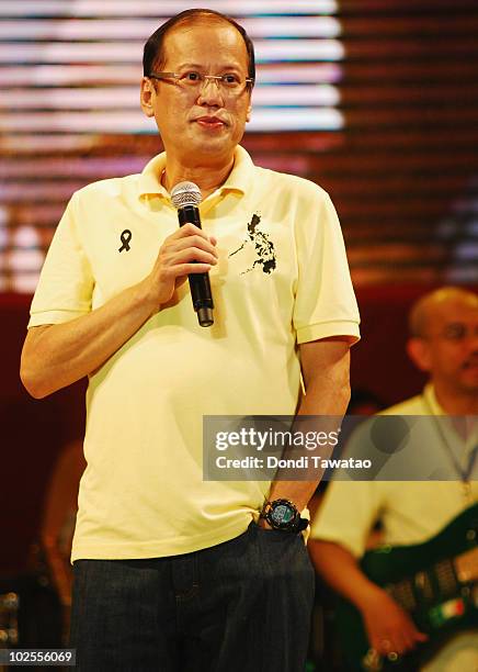 Incoming President-elect Benigno 'Noynoy' Aquino sings during the inauguration street party of Aquino as the fifteenth President of the Philippines...