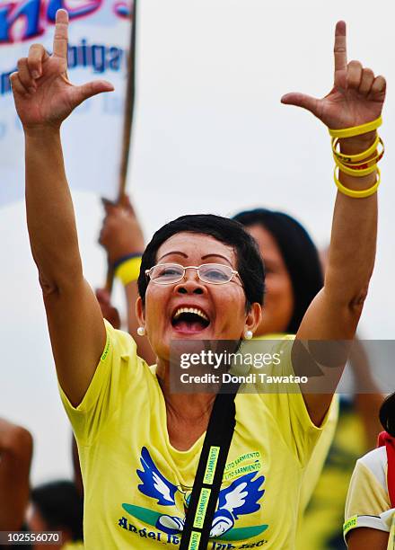 Supporter flashes the 'Laban' sign, symbol of people power during the inauguration of Noynoy Aquino as the fifteenth President of the Philippines at...