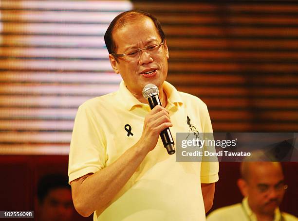 Incoming President-elect Benigno 'Noynoy' Aquino sings during the inauguration street party of Aquino as the fifteenth President of the Philippines...