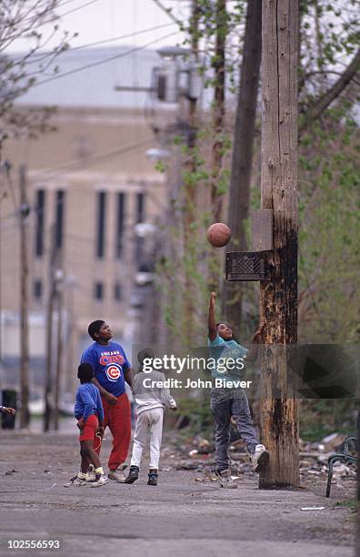 Playoffs: Scenic view of neighborhood children playing basketball with home made hoop, a milk crate, outside of Chicago Stadium before Chicago Bulls...