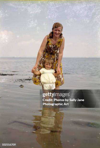 mother & daughter paddling circa  - 1960s woman stock pictures, royalty-free photos & images