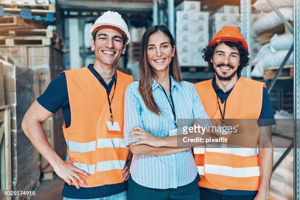 warehouse team - waistcoat stock pictures, royalty-free photos & images