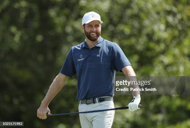 Chris Kirk of the United States reacts on the 17th tee during the first round of the Dell Technologies Championship at TPC Boston on August 31, 2018...