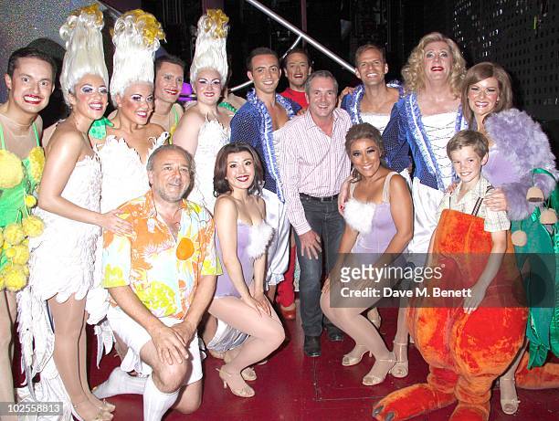 Actor Alan Fletcher poses backstage with cast members from "Priscilla Queen of the Desert" at the Palace Theatre on June 30, 2010 in London,England.