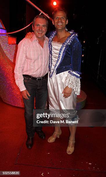 Actor Alan Fletcher poses backstage with cast members from "Priscilla Queen of the Desert" at the Palace Theatre on June 30, 2010 in London,England.