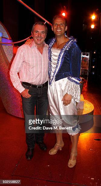 Actor Alan Fletcher poses backstage with cast members from "Priscilla Queen of the Desert" at the Palace Theatre on June 30, 2010 in London,England.