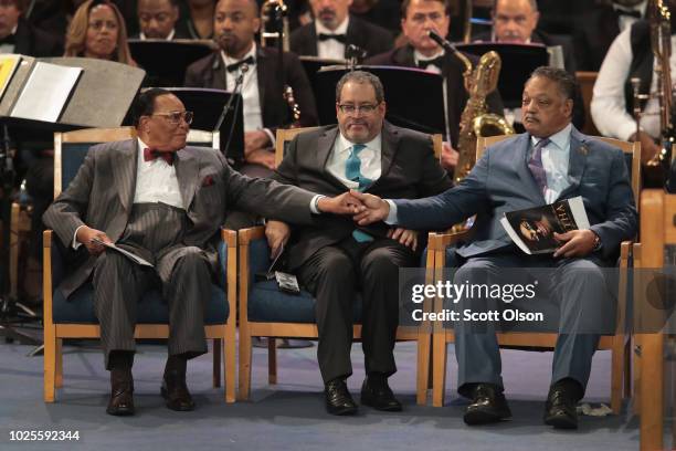 Minister Louis Farrakhan greets Rev. Jesse Jackson after Jackson spoke at the funeral for Aretha Franklin at the Greater Grace Temple on August 31,...