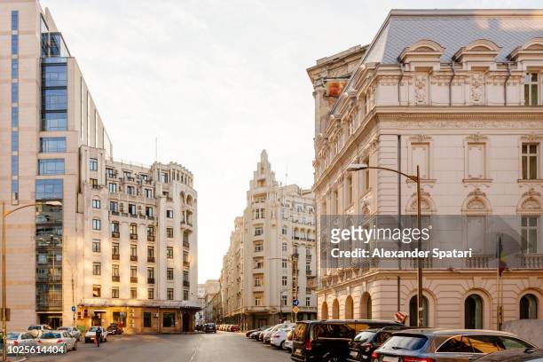 city street in bucharest old town with historical buildings - bucharest stock pictures, royalty-free photos & images