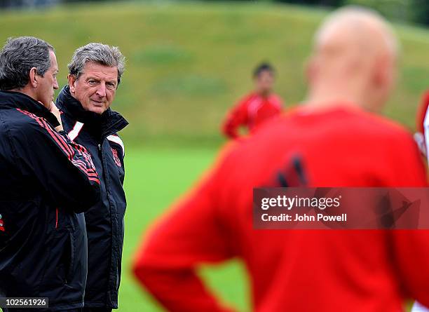 Roy Hodgson manager of Liverpool FC watches a training session with the Head of Sports Medicine and Sports Science Peter Brukner on the day he was...