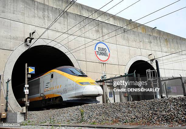 An Eurotunnel shuttle transporting cars from London leaves the Channel tunnel, before arriving at the Eurotunnel terminal in Coquelles, near Calais,...