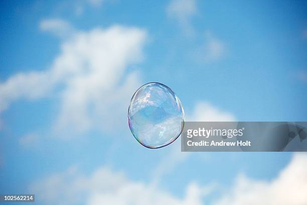 single soap bubble against blue sky - bubbles stock pictures, royalty-free photos & images