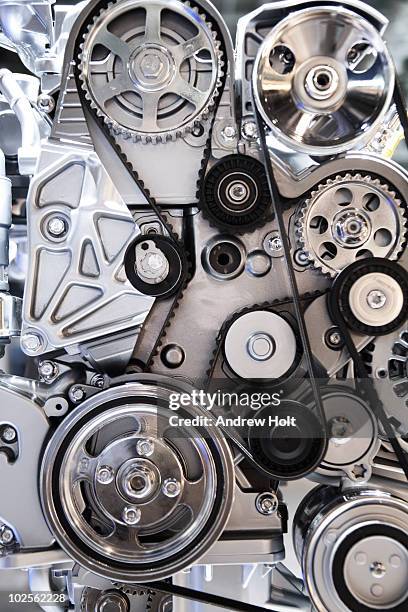 cogwheels and drive belts of motor car - engine photos et images de collection