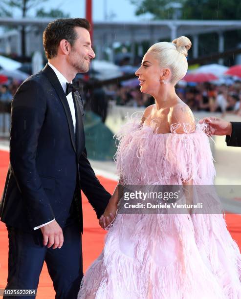 Lady Gaga and Bradley Cooper walk the red carpet ahead of the 'A Star Is Born' screening during the 75th Venice Film Festival at Sala Grande on...