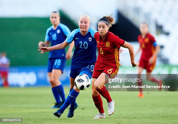 Vicky Losada of Spain and Eveliina Summanen of Finland compete for the ball during the FIFA Women's World Cup 2019 qualifier between Spain and...