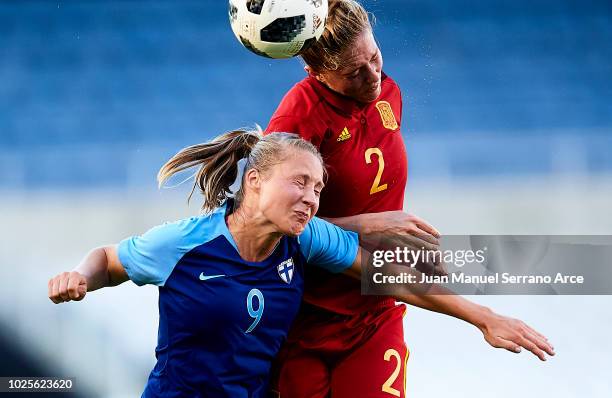 Celia Jimenez of Spain and Juliette Kemppi of Finland compete for the ball during the FIFA Women's World Cup 2019 qualifier between Spain and Finland...