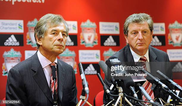 Roy Hodgson manager of Liverpool FC sits next to chairman Martin Broughton as he speaks to the media during a press conference to unveil him as the...