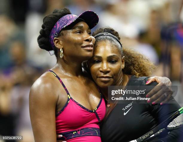 Serena Williams of The United States is congratulated by her sister and opponant Venus Williams of The United States following their ladies singles...