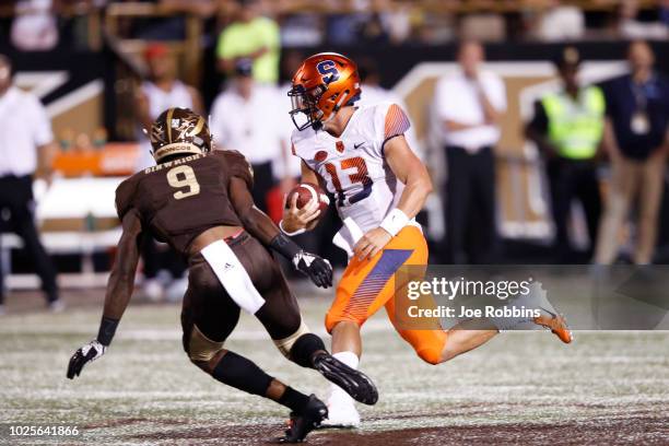 Tommy DeVito of the Syracuse Orange runs the ball against the Western Michigan Broncos in the third quarter of a game at Waldo Stadium on August 31,...