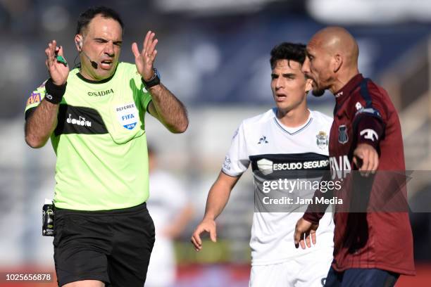 Referee Silvio Truco gestures during a match between Gimnasia y Esgrima La Plata and Talleres as part of Superliga 2018/19 at Estadio Juan Carmelo...