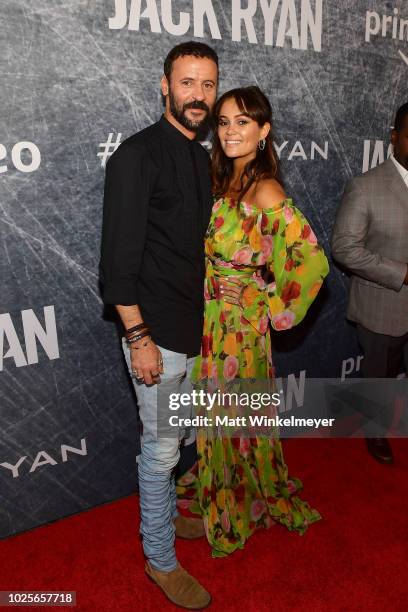 Ali Suliman and Dina Shihabi attend the premiere of "Tom Clancy's Jack Ryan" at The Opening Night of Los Angeles Fleet Week 2018 at Battleship Iowa...