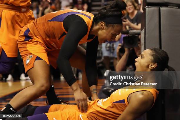 DeWanna Bonner of the Phoenix Mercury celebrates with Briann January after scoring against the Seattle Storm during game three of the WNBA Western...