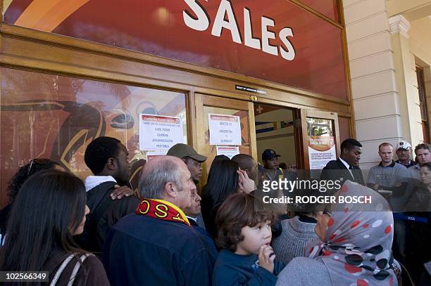 People queue to buy World Cup tickets at the FIFA Ticketing Centre, on July 1 2010, in Cape Town two days before the quarter final football match...