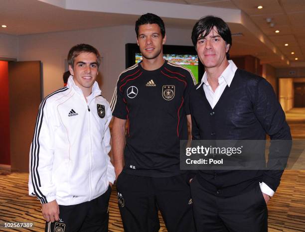 Head coach of Germany Joachim Loew poses with Michael Ballack and Philipp Lahm in the Hotel Southern Sun on July 1, 2010 in Capetown, South Africa.