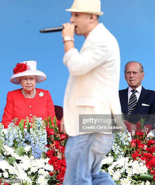 Queen Elizabeth II and Prince Philip, Duke of Edinburgh watch performers during Canada Day celebrations on Parliament Hill on July 1, 2010 in Ottawa,...