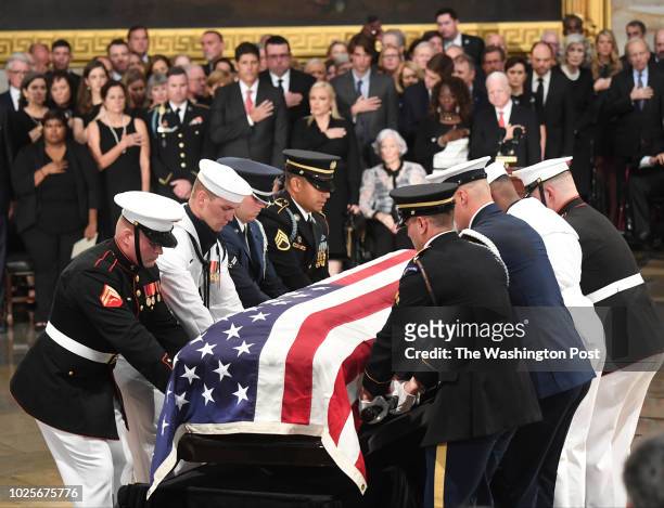 The body of late-Sen. John S. McCain arrives to lie in state during a ceremony to honor the six-term senator from Arizona in the Capitol Rotunda on...