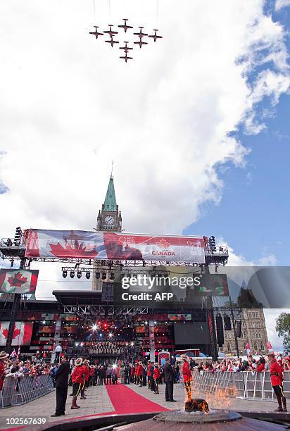 The Snowbirds Demonstrations Team flies past the Peace Tower during Canada Day celebrations on Parliament Hill in Ottawa, Ontario, July 1, 2010....