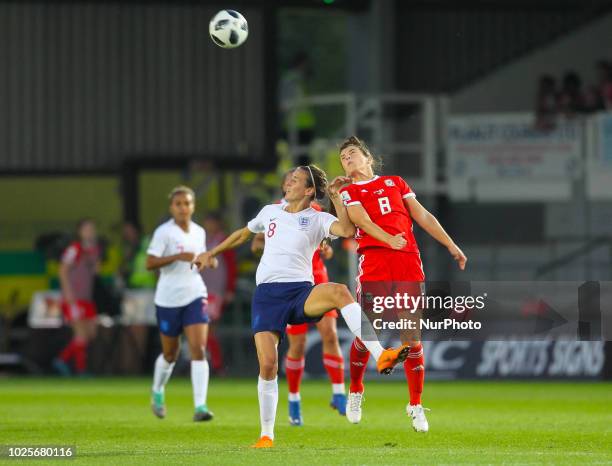 Jill Scott of England Women and Angharad James of Wales Women challenge for the ball during 2019 FIFA Women's World Cup Group 1 qualifier between...