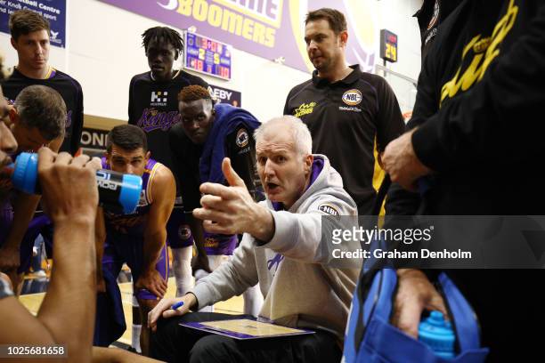 Sydney Kings Head Coach Andrew Gaze talks to his players during the NBL pre-season match between Melbourne United and the Sydney Kings at State...