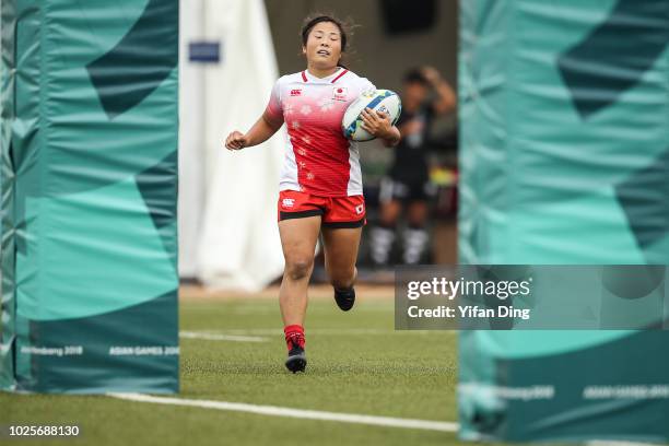 Okuroda Yume of Japan in action during Rugby Sevens Women's Semi Final between Japan and Kazakhstan at GBK Rugby Field on day fourteen of the Asian...