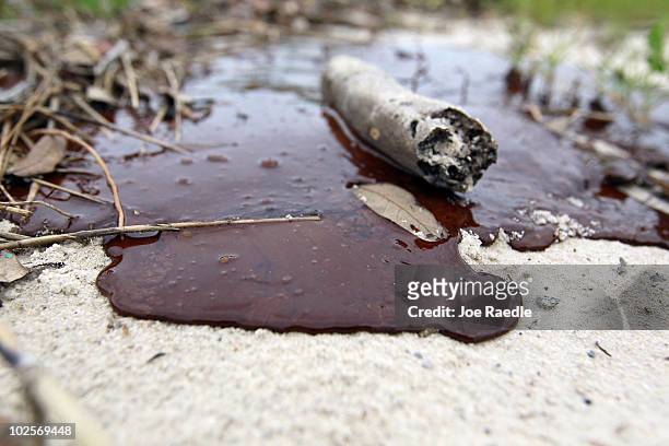 Thick oil is seen washed ashore from the Deepwater Horizon oil spill in the Gulf of Mexico on July 1, 2010 in Gulfport, Mississippi. Millions of...