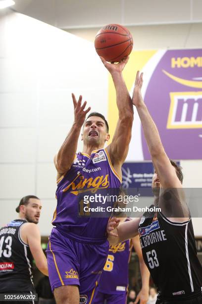 Kevin Lisch of the Sydney Kings drives at the basket during the NBL pre-season match between Melbourne United and the Sydney Kings at State...