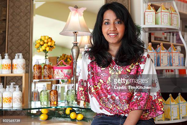 woman in spa boutique, smiling, portrait. - medium length hair stock pictures, royalty-free photos & images
