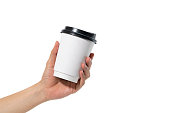 female hand holding a coffee paper cup isolated on white background.