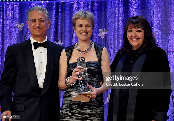 President & CEO Del Bryant and Richard Kirk Award recipient Rachel Portman and Vice President, Film/TV Relations Doreen Ringer Ross pose onstage...