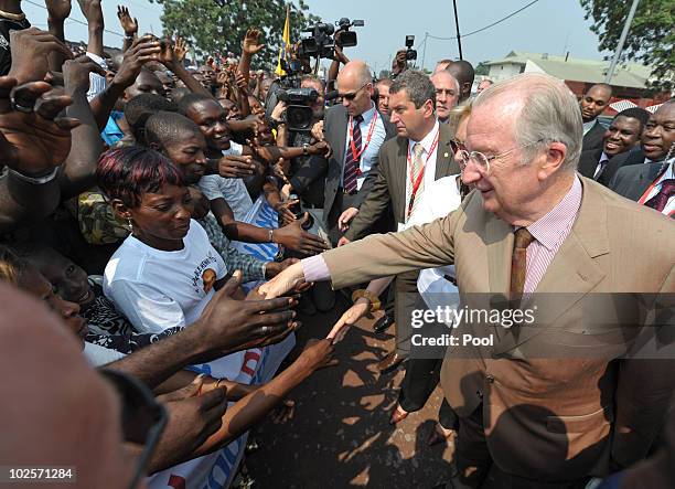 King Albert II of Belgium and Queen Paola of Belgium are welcomed as they visit the King Boudewijn Hospital on July 1, 2010 in Kinshasa, Democratic...