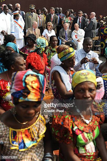 Queen Paola of Belgium and King Albert II of Belgium watch as performers enact a scene during a visit to the King Boudewijn Hospital on July 1, 2010...