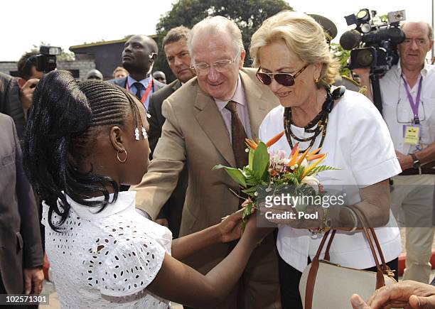 Queen Paola and King Albert II of Belgium are welcomed during a visit to the King Boudewijn Hospital on July 1, 2010 in Kinshasa, Democratic Republic...