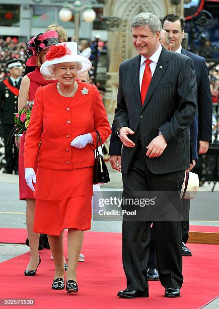 Queen Elizabeth II with Stephen Harper the Prime Minister of Canada outside the Parliament Building after arriving to attend the Canada Day...