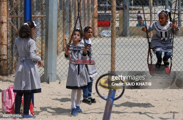 Palestinian school girls play at UN Relief and Works Agency's school in the Rafah refugee camp, southern Gaza Strip, on September 1, 2018. The United...
