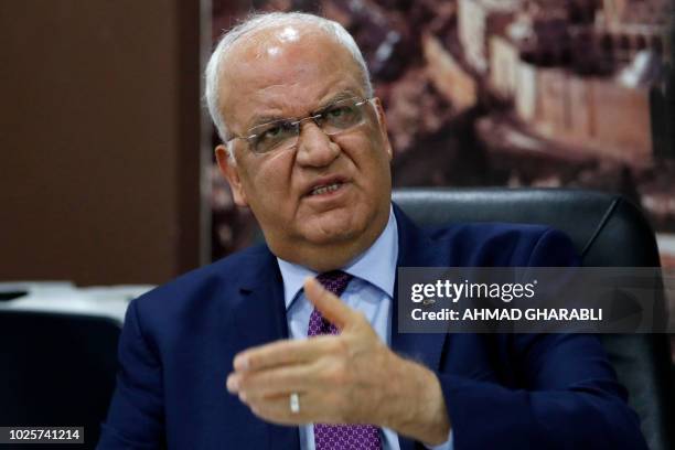 Secretary general of the Palestine Liberation Organisation Saeb Erekat speaks to journalists in the West Bank city of Ramallah on September 1, 2018....