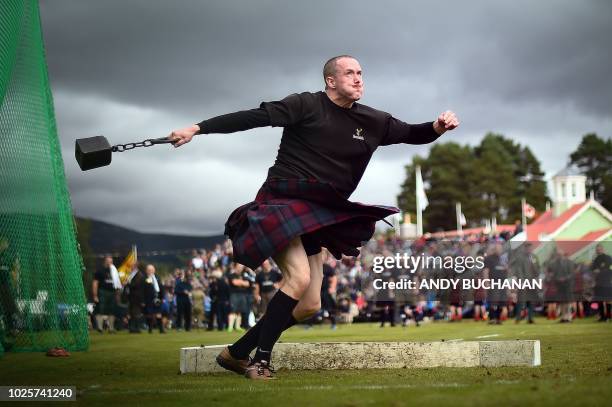 Competitor takes part in the Hammer Throw event at the annual Braemar Gathering in Braemar, central Scotland, on September 1, 2018. - The Braemar...