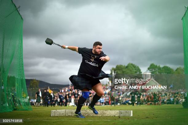Competitor takes part in the Hammer Throw event at the annual Braemar Gathering in Braemar, central Scotland, on September 1, 2018. - The Braemar...
